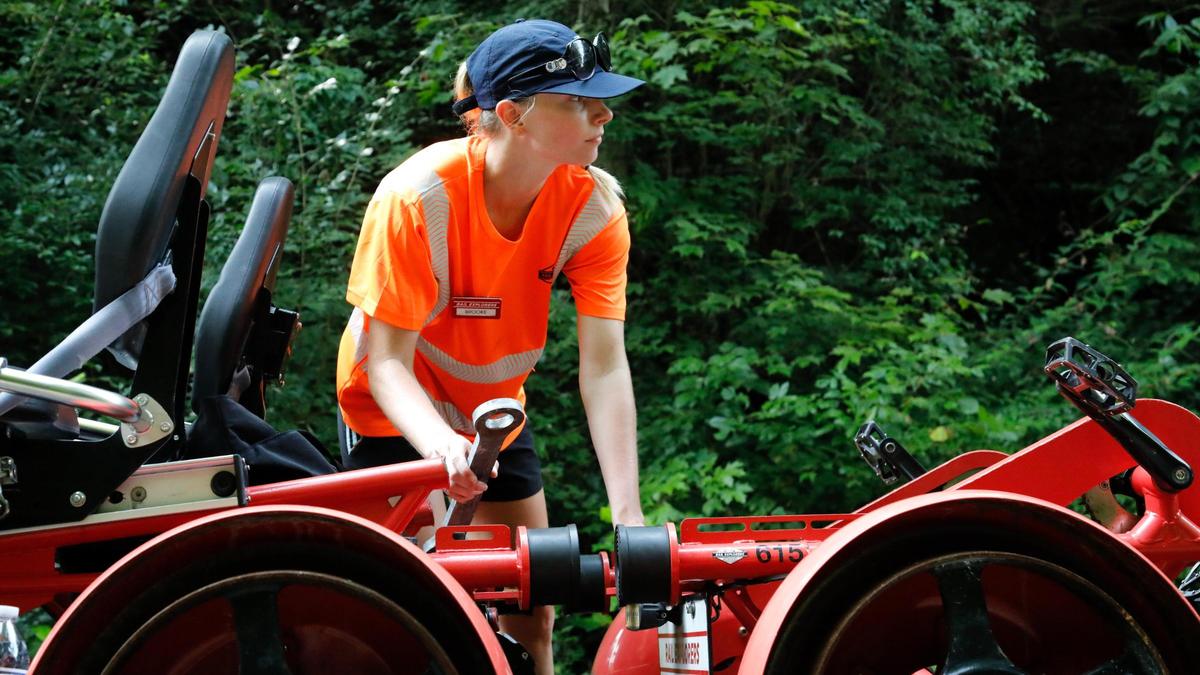 Brooke Trompler connects two “Rail Explorers” on Friday, Aug. 4, 2023 at the Bluegrass Scenic Railroad and Museum in Versailles, Ky.