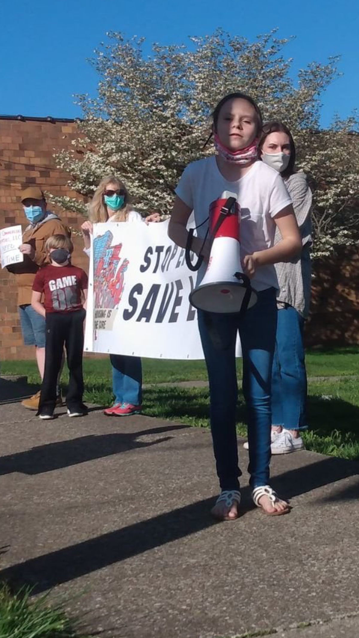 Shayna Hamilton protesting against the eviction of residents from the North Fork Mobile Home Park in Morehead.