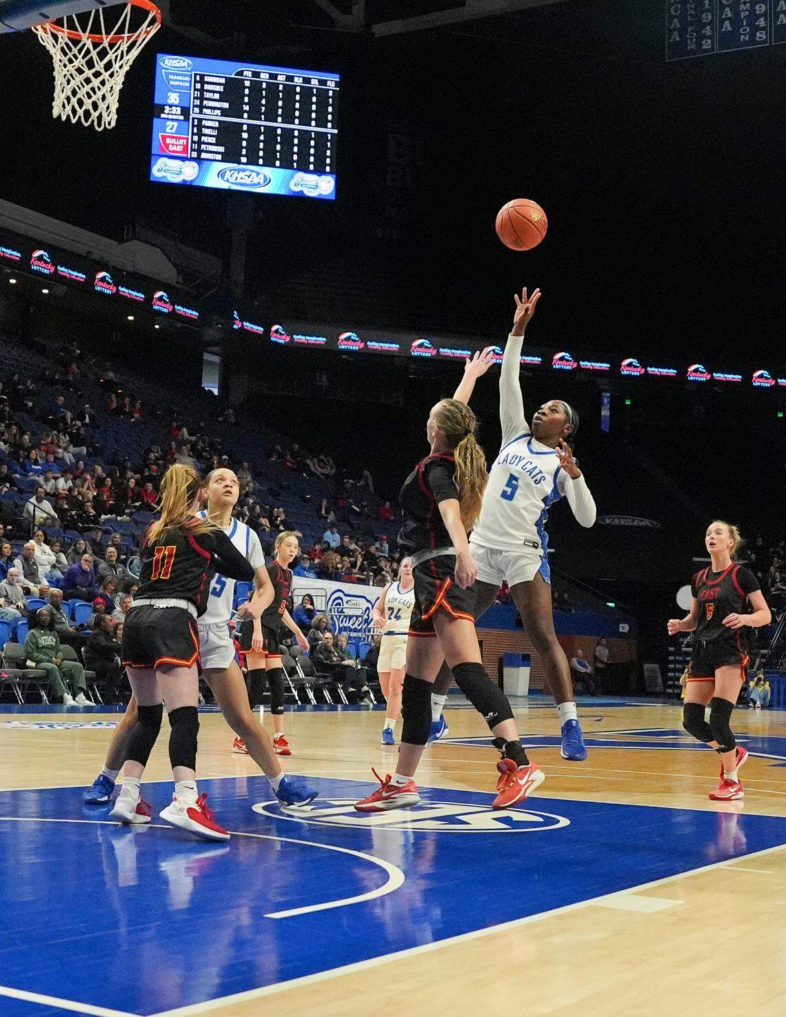 Franklin-Simpson's Tiffany Harrigan (5) pulls up for a shot at the free-throw line during the Clark’s Pump-N-Shop Girls’ Basketball Sweet 16 first round against Bullitt East at Rupp Arena on Thursday.