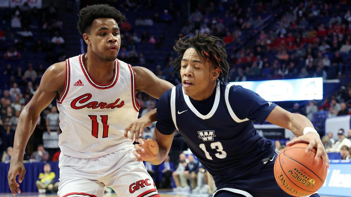 Warren Central’s Omari Glover (13) drives near Clark County’s Jerone Morton (11) during the championship of the UK Healthcare Boys’ Sweet 16 at Rupp Arena in Lexington, Ky., Saturday, March 19, 2022. (Photo by James Crisp)