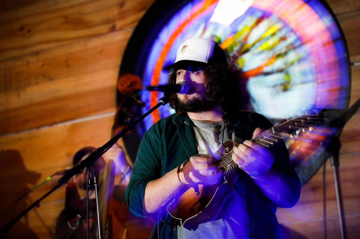 Harry Clark, mandolin player for The Wooks rehearses Wednesday with the band ahead of Wook-O-Ween, an outdoor concert this Saturday at The Burl.
