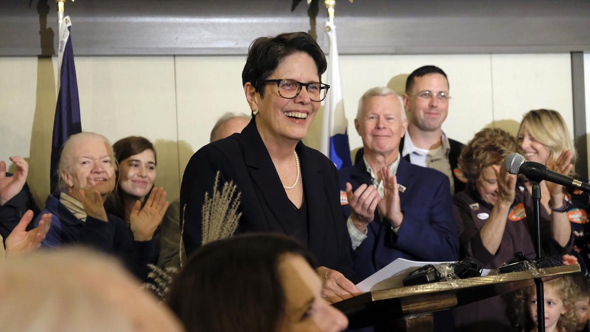 Mayor-elect Linda Gorton addressed supporters at her election watch party at the old Fayette County Courthouse in Lexington on Tuesday evening. Her husband, Charles, and son, Clay, are behind her at right.