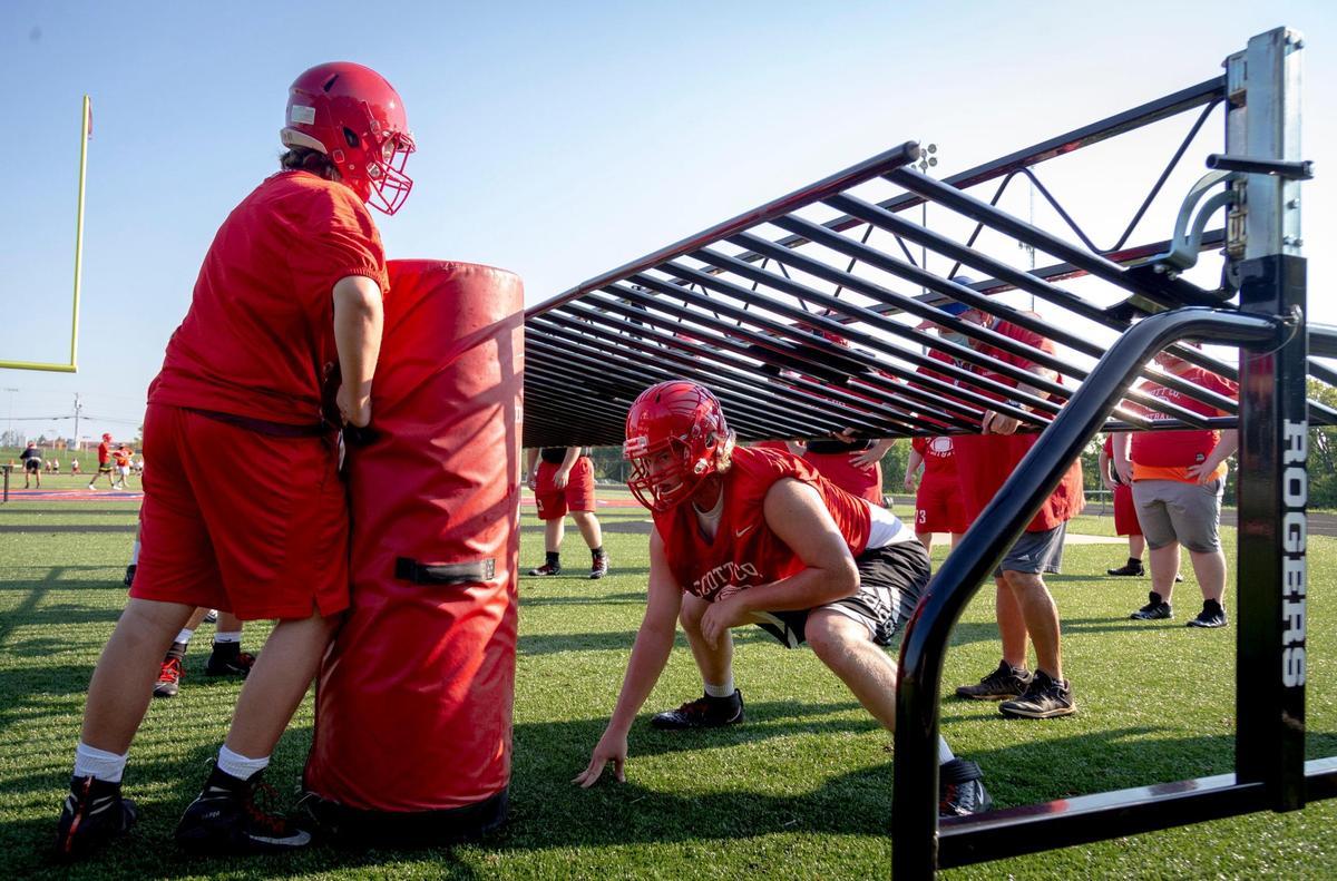 Scott County offensive lineman Ethan Miracle (50) crouched for a drill during the first practice with helmets on in Georgetown on Monday.