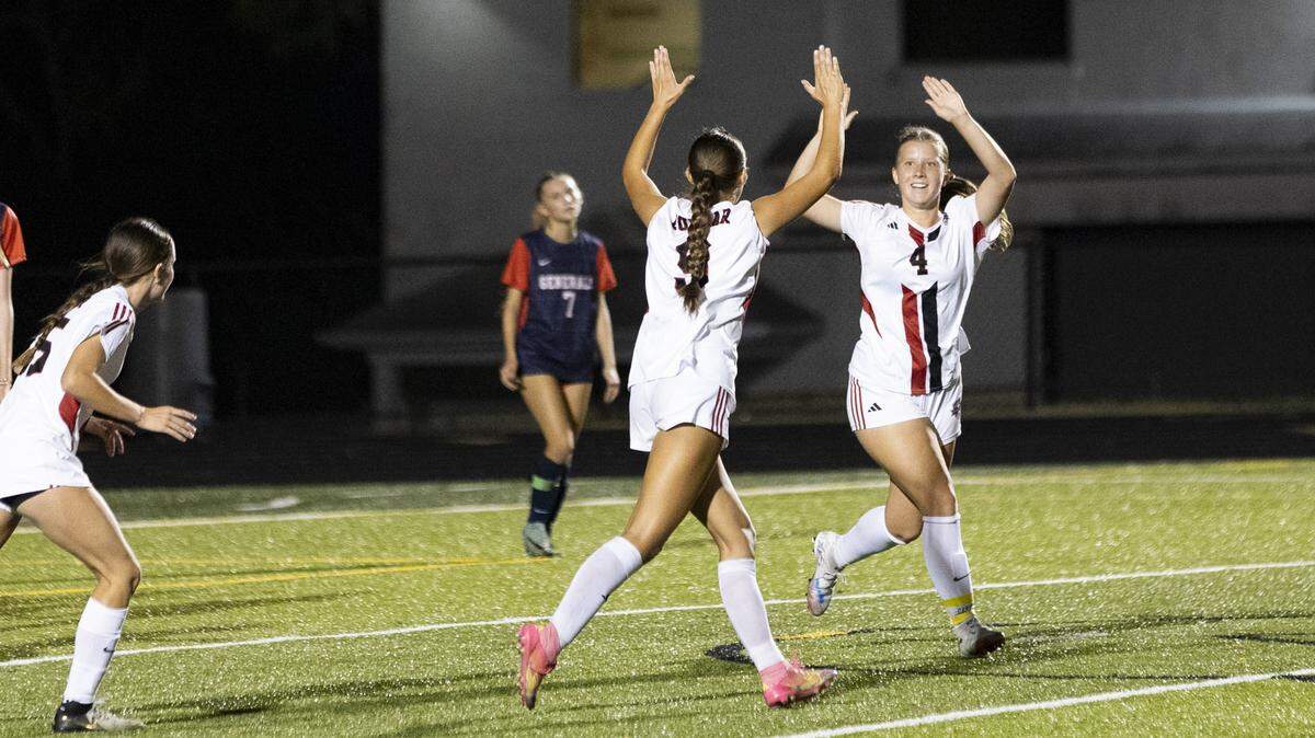 Paul Laurence Dunbar’s Kennedy Morgan (4) celebrates her goal with teammate Aubrey Thuringer during the Bulldogs’ 4-0 win at Lafayette High School on Monday.