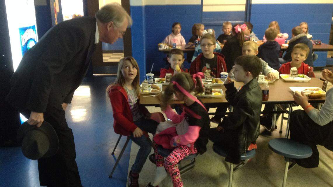 Superintendent Larry Warren chatted with students in November in the cafeteria shared by preschool through 12th grade at the Barbourville Independent Schools campus. Many students in the district come from unstable home situations. Warren says the loss of outside funds has meant deep cuts to services, including after-school tutoring.