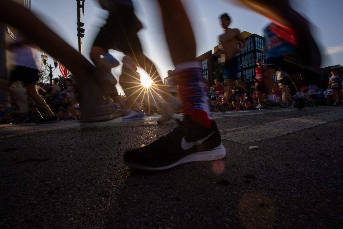 Runners compete in the the Bluegrass 10K in downtown Lexington, Ky., Thursday July 4, 2019.