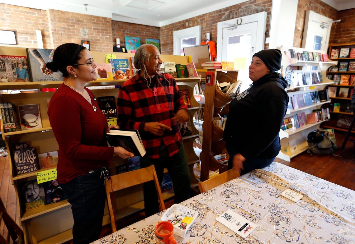 L-R: Faith Evans, Jim Embry, April Taylor talked at The Wild Fig Book Store, 726 North Limestone Street.The book store, which closed in September has re-opened, this time as a worker cooperative helmed by April Taylor. The new Fig includes books, coffee, food and pastries and co-working space.