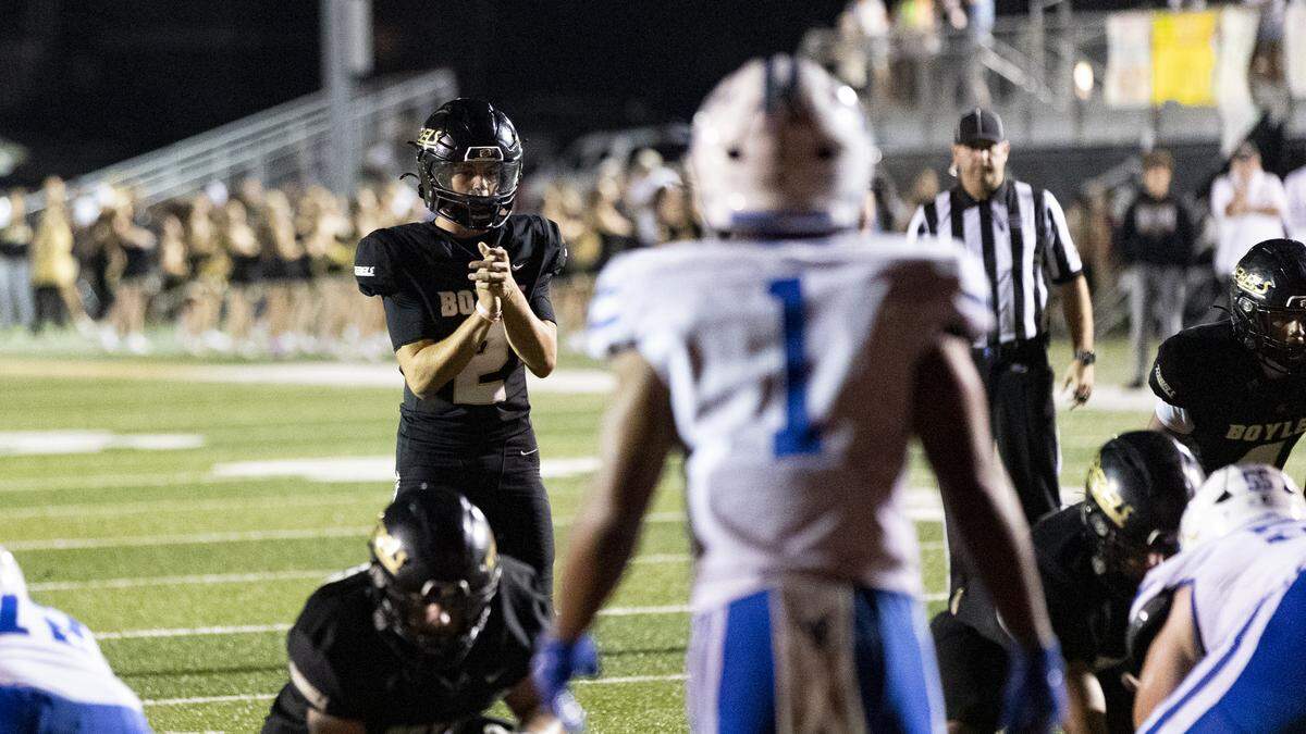 Boyle County quarterback Jhet Raleigh awaits a snap in the second half against Highlands in the Rebels’ 21-20 win at Rebel Stadium in Danville on Friday.