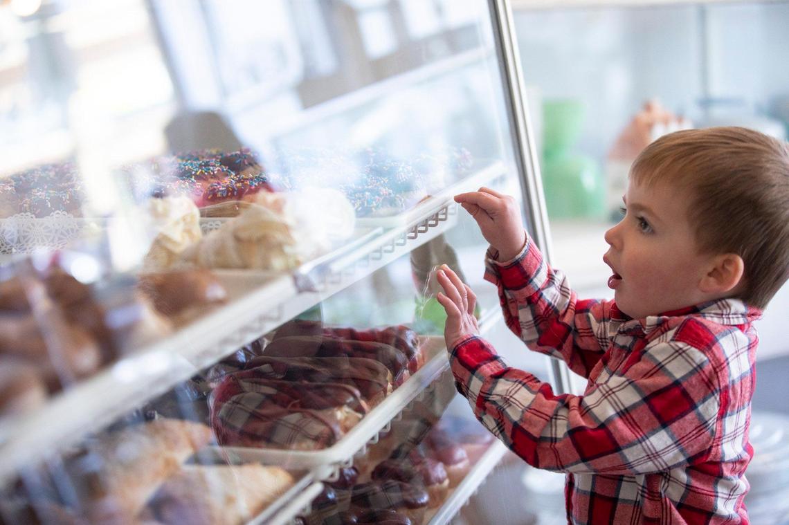 Henry Rogers, 2, of Frankfort, looks at sweets at B’s Bakery in Frankfort, Ky., Friday, Feb. 28, 2020.