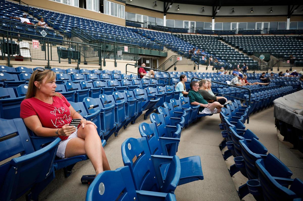 Marci Epperson of Louisville watched her son Myles Epperson play on the Xpress Green team during a Commonwealth Collegiate Baseball League game at Whitaker Bank Ballpark in Lexington on Tuesday.