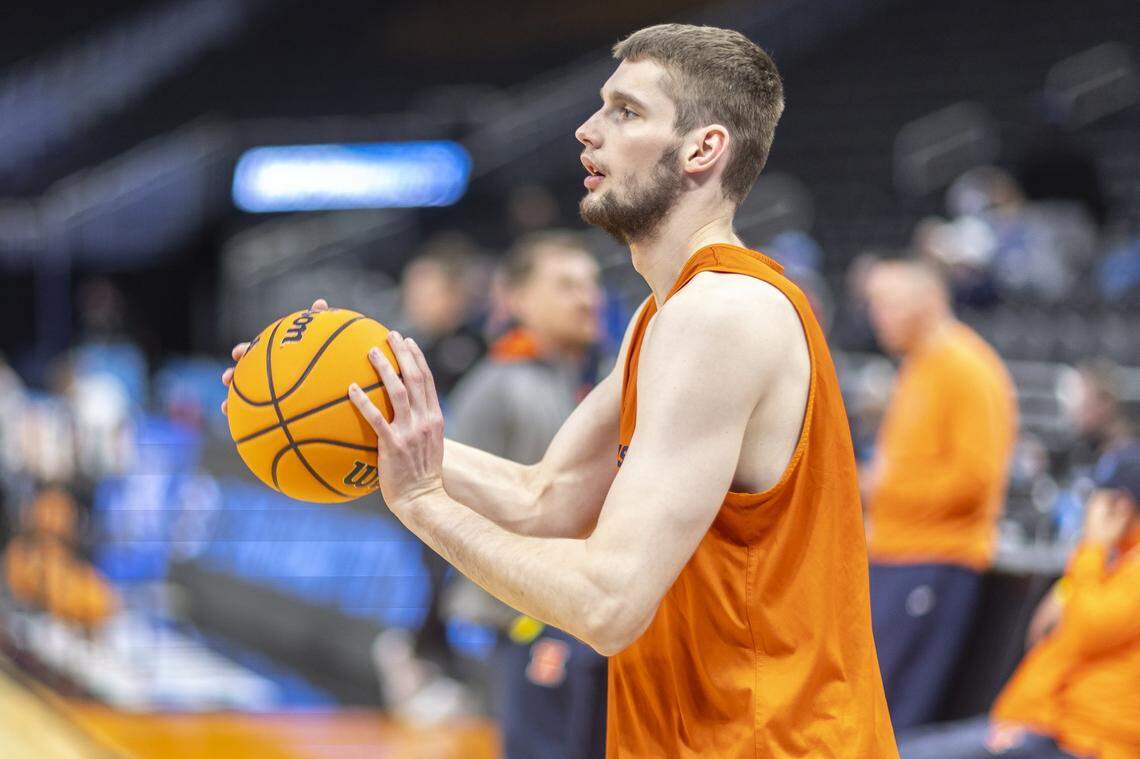 Illinois center Tomislav Ivisic prepares to take a shot during an open practice at Fiserv Forum in Milwaukee on Thursday, a day before Illinois’ first-round NCAA Tournament game.