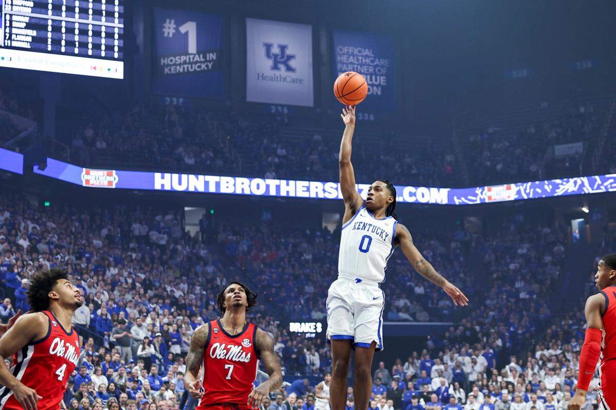 Kentucky Wildcats guard Rob Dillingham (0) shoots the ball against Mississippi Rebels guard Allen Flanigan (7) during the game at Rupp Arena in Lexington Tuesday, February 13, 2024.