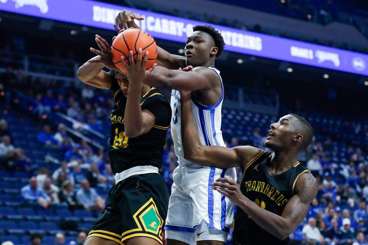 Kentucky’s Adou Thiero (3) fights for a rebound against Kentucky State during Thursday’s exhibition game at Rupp Arena.