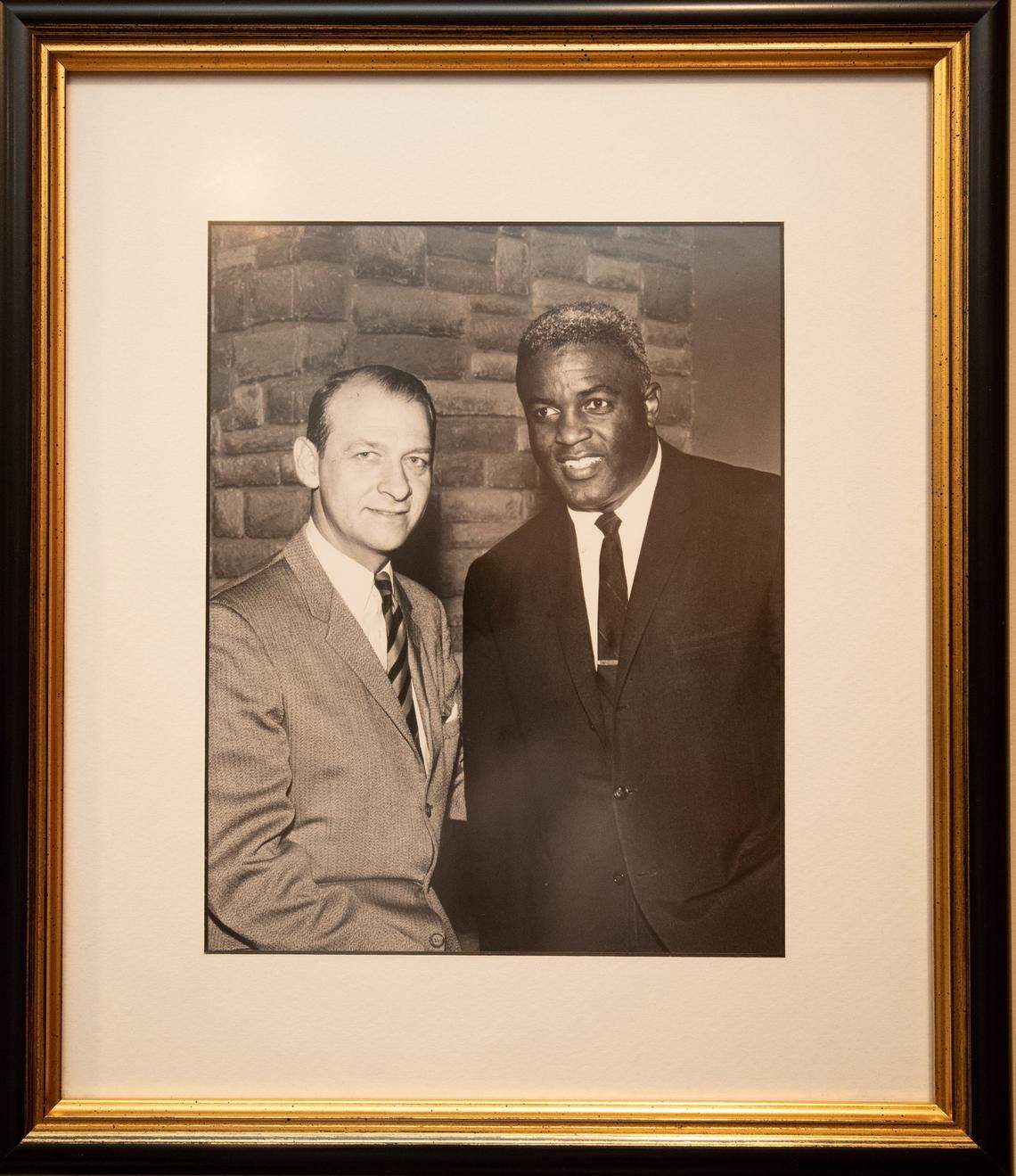 This picture of legendary University of Kentucky radio play-by-play broadcaster Cawood Ledford, left, with Brooklyn Dodgers great Jackie Robinson was given to Jim Host by Ledford shortly before he died in 2001.