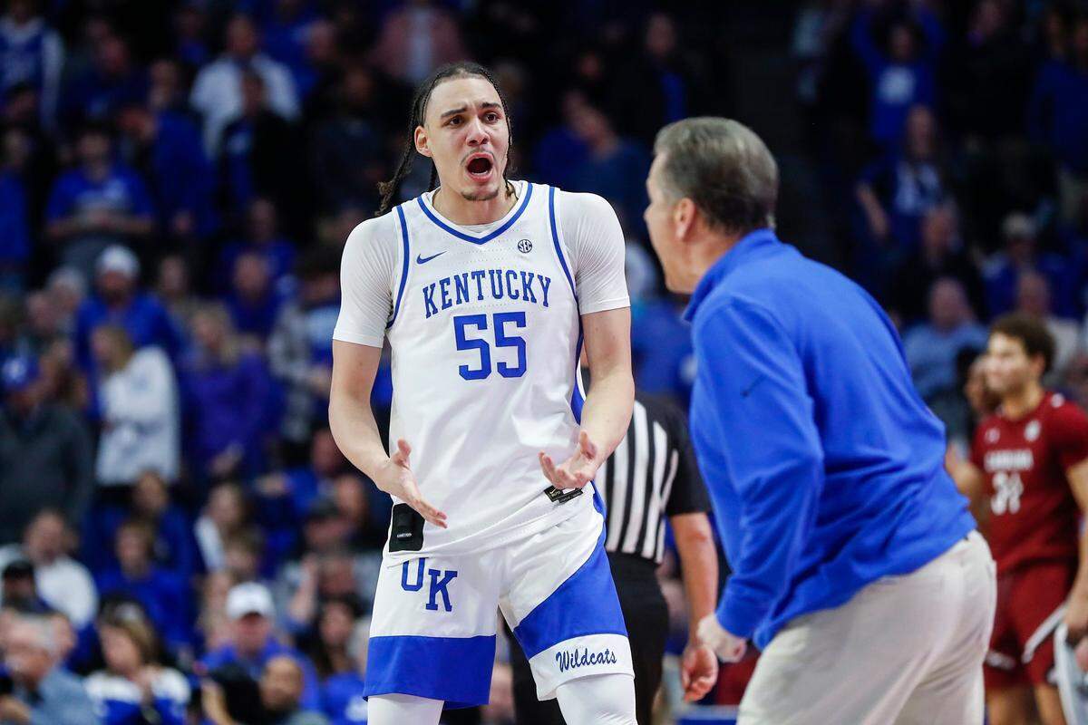 Kentucky forward Lance Ware (55) talks with head coach John Calipari after South Carolina scored during Tuesday’s game at Rupp Arena.