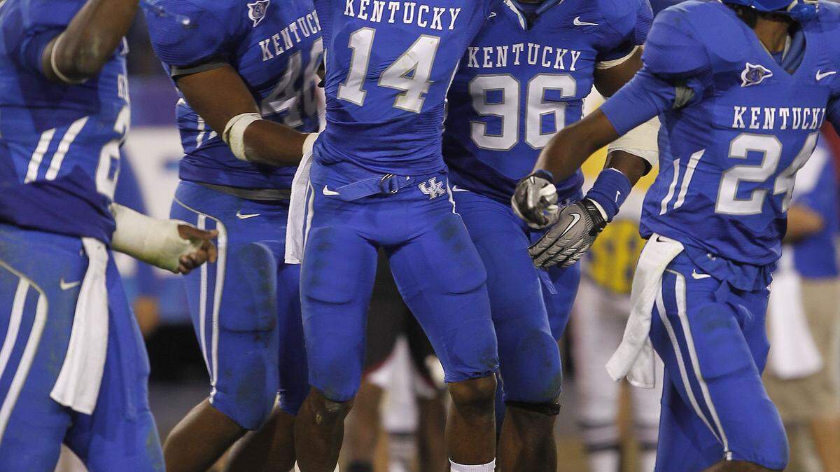 Anthony Mosley (14) celebrated his game-clinching interception against South Carolina during the Cats' 31-28 victory in 2010.