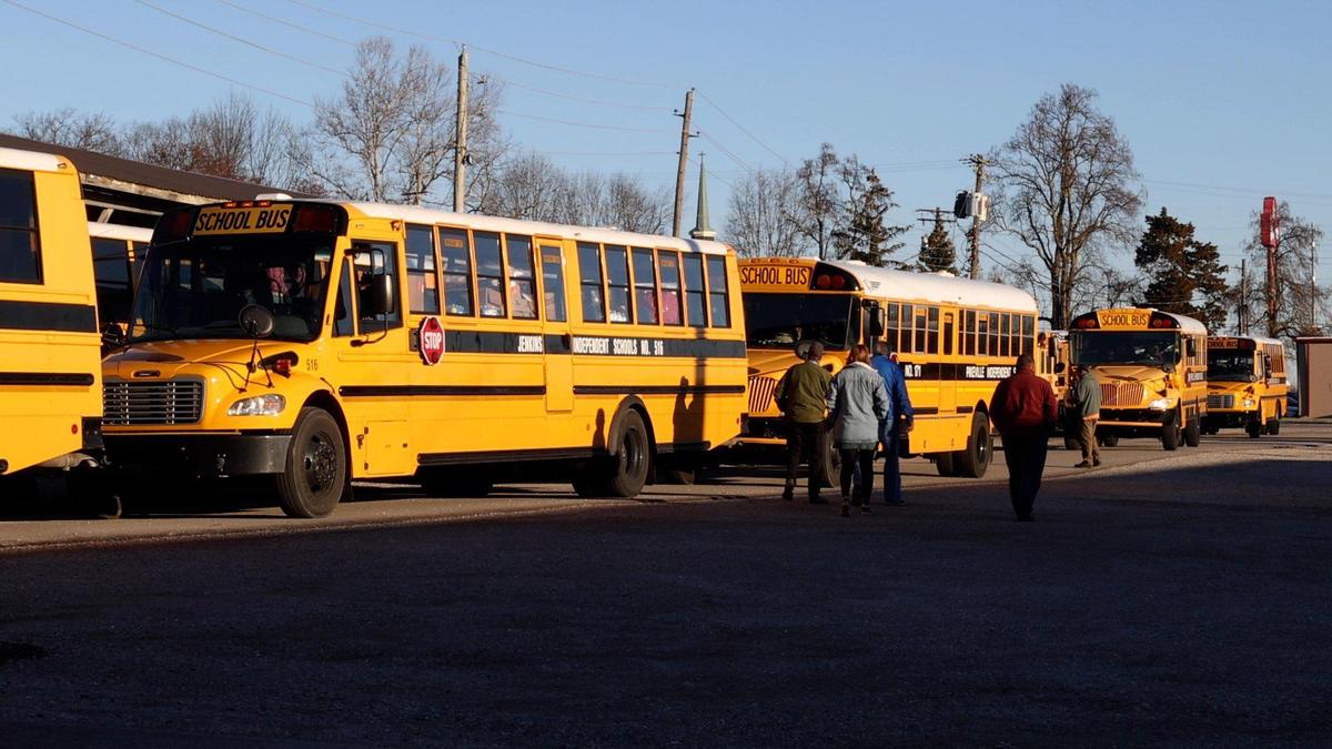 Nearly 70 school buses, trailers, and vans from over 30 school districts full of donated items for western Kentucky tornado victims gather in the morning at Winchester Board of Education lot in Winchester to caravan to different areas of Western Kentucky, organized by Trace Creek Construction Inc. CEO Sam Howard and Superintendent and Greenup County Superintendent Traysea Moresea. December 20, 2021.