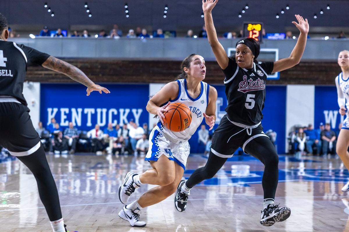 Kentucky guard Georgia Amoore (3) drives the ball as Mississippi State guard Chandler Prater (5) defends during a game at Memorial Coliseum on Jan. 2.