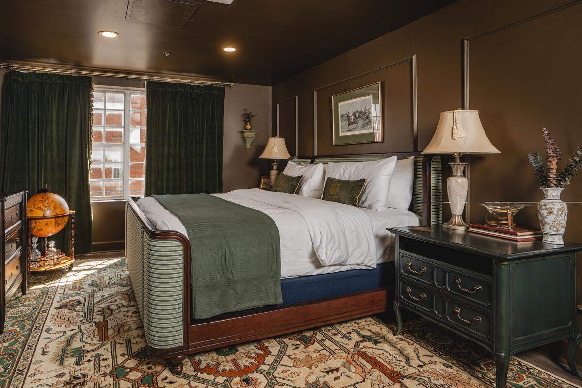 A Deluxe King room at The Aldenberg Hotel comes with panoramic views of historic downtown Versailles, Ky. 