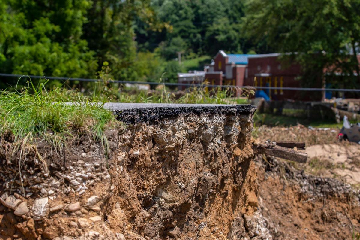 A section of road along KY-3351 by a bridge over Troublesome Creek near Ary in Perry County, Ky., remains damaged Tuesday, Aug. 2, 2022, following flooding last week that devastated many counties in Eastern Kentucky.