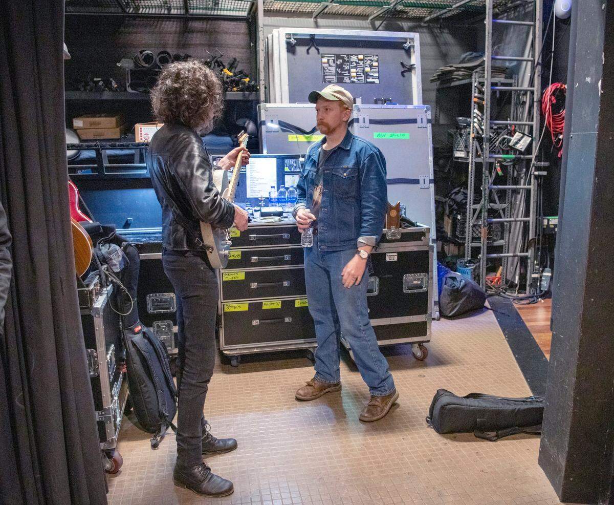 Tyler Childers, right, talks with Kenny Vaughan, of Marty Stuart and his Fabulous Superlatives backstage of the Ryman Auditorium in Nashville, Tenn. The Lawrence County native is in the middle of a two-week residency at the famous institution. Marty Stuart opened for the Lawrence County native and two of his former school teachers performed a song.