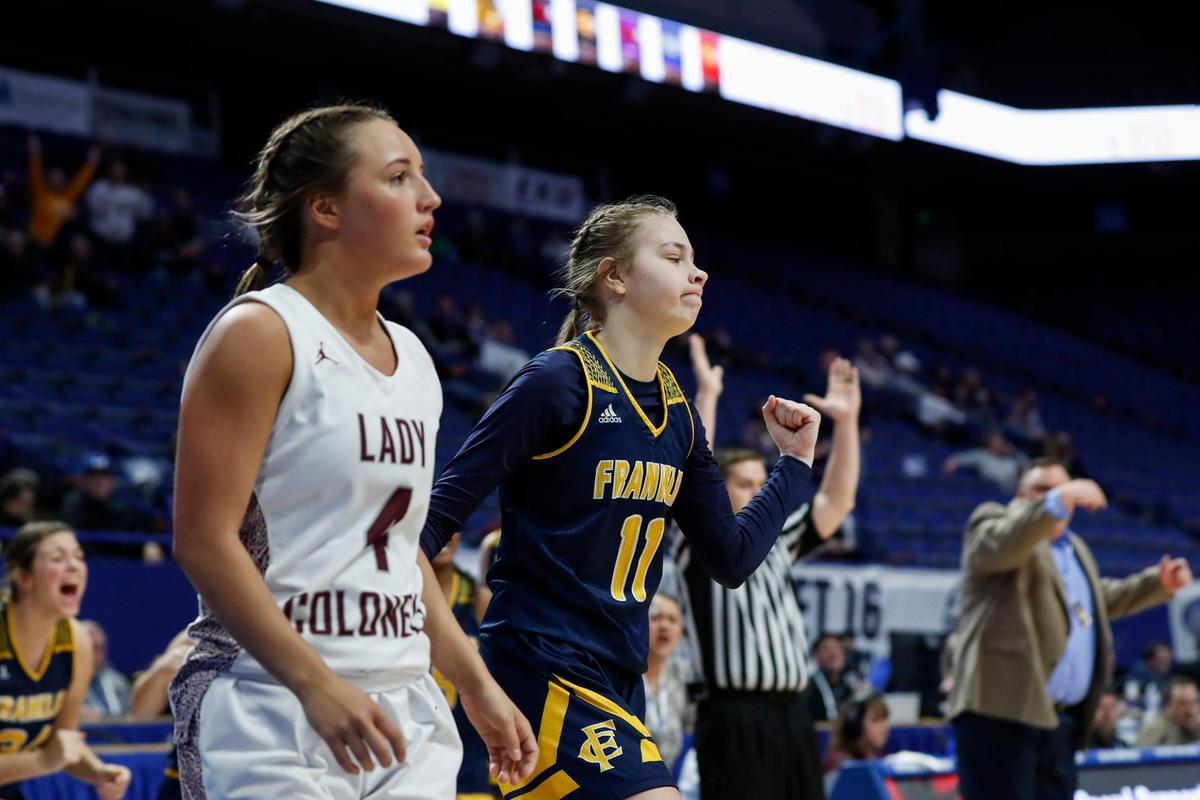 Franklin County’s Cameryn Ridderikhoff (11) celebrates after making a three-pointer over Henderson County’s Savannah Lacer (4) during Wednesday night’s first-round game in Rupp Arena.