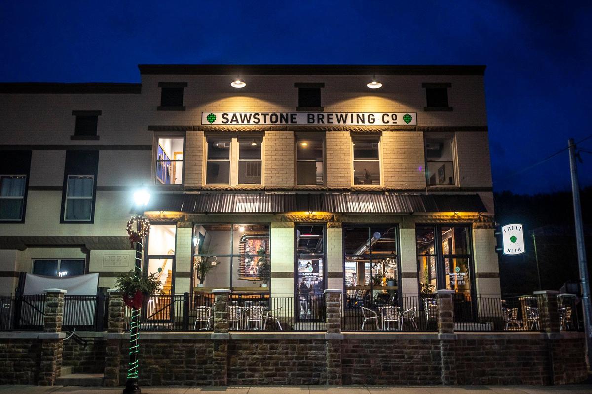 The three owners of Sawstone Brewing Co. met the landlord for the more than 100-year-old historic and vacant corner property at 175 E. Main St. during the 2017 Brew! Ha! Ha!, a Morehead homebrew event.