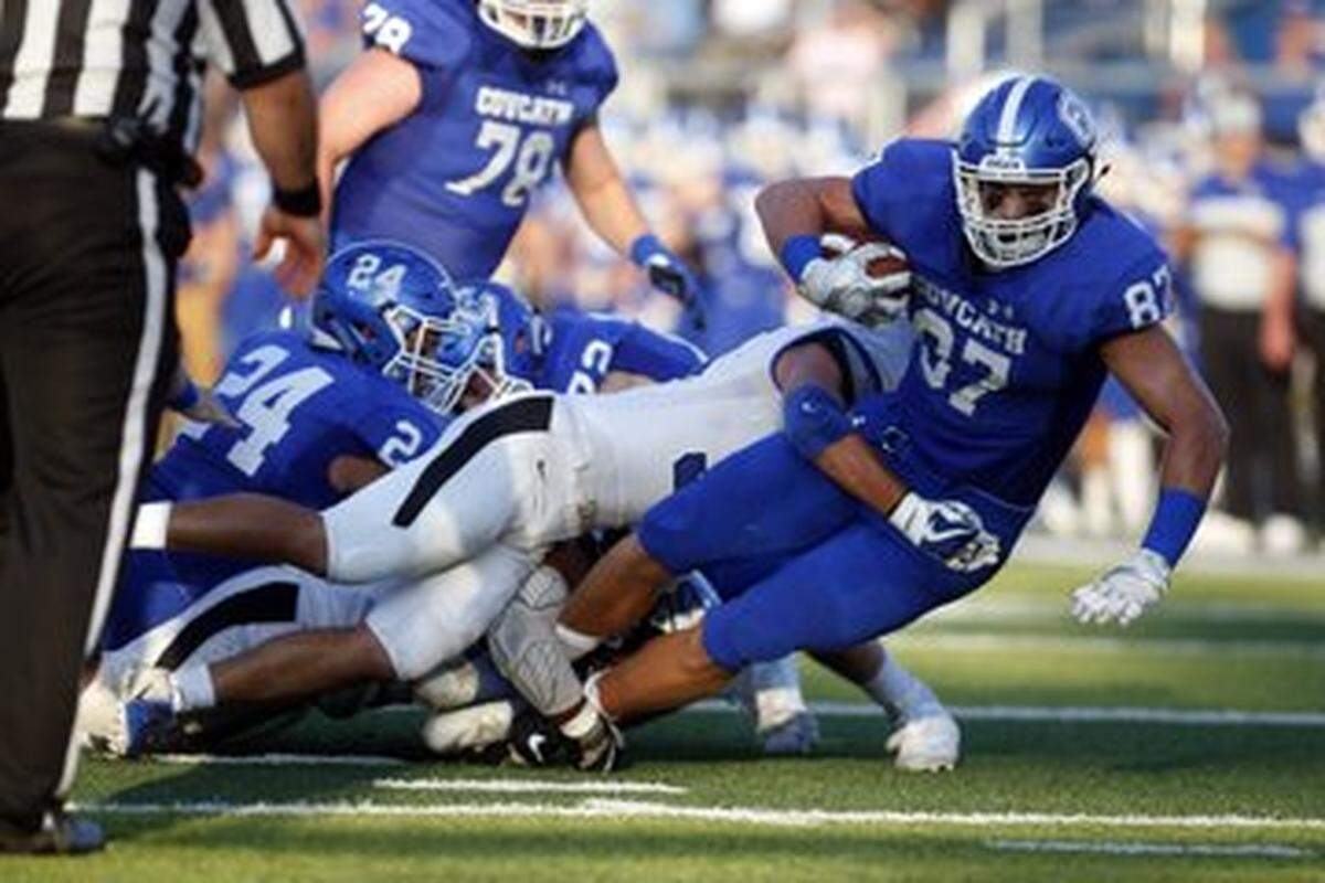 Covington Catholic’s Michael Mayer (87) was tackled during the Colonels’ 39-38 home win over Lexington Catholic on Friday night.