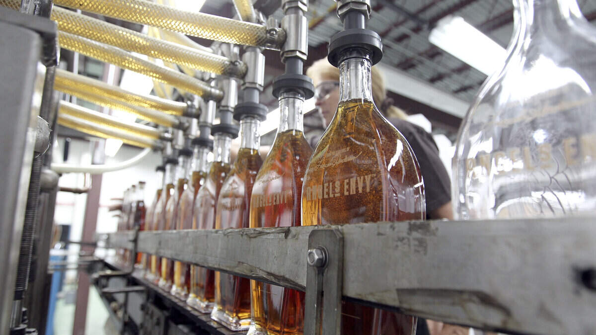 Vanessa Miller watched as 8 bottles of Angel's Envy Rye Whiskey were filled at Strong Spirits 999 Withrow Ct. in Bardstown, Ky., Wednesday, July 03, 2013. Angel's Envy bourbon and rye whiskey is aged and bottled in this facility. The rye whiskey was finished in Caribbean rum casks. Photo by Charles Bertram | Staff