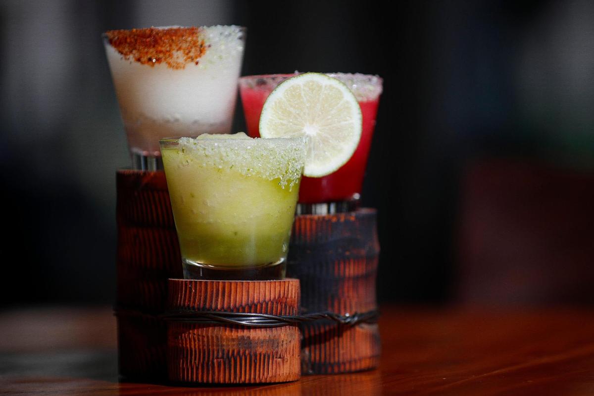 The signature margarita slush flight including the Margarita de Casa with prickly pear, the Rocoto Spiced Margarita and the Green Goddess Margarita at Corto Lima.
