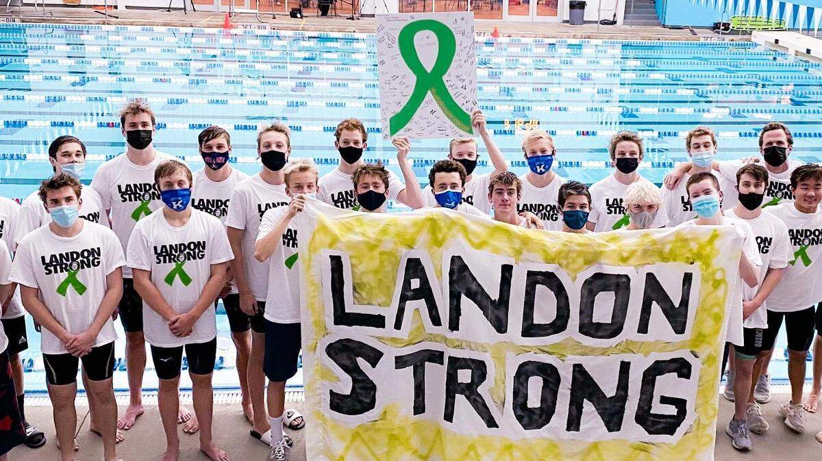 The Henry Clay Blue Devils’ boys’ swim team posed with a “Landon Strong” banner in support of teammate Landon Jennings, who could not attend Saturday’s KHSAA State Swimming and Diving Championships due to an undisclosed, but non-COVID-19 related, health issue. The boys’ team finished third in the event.