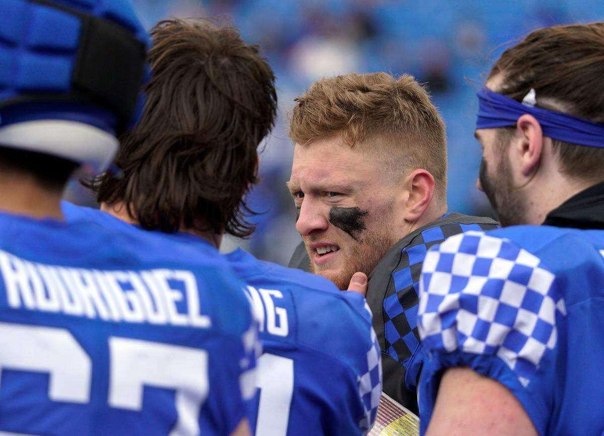 Kentucky QB Will Levis, center, has “got all the potential in the world. He just has to go out and take advantage of it,” Tim Couch said.