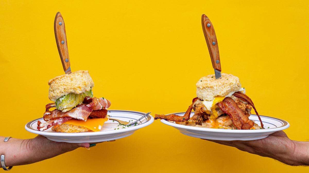 Towanda’s BLT, left, features bacon, lettuce wedge, fried green tomatoes, blue cheese dressing while the Rockwell Supreme from Biscuit Belly features buttermilk fried chicken thigh, cheddar, goetta sausage gravy, an over easy egg and bacon. Biscuit Belly is opening a Columbus, Ga. location.