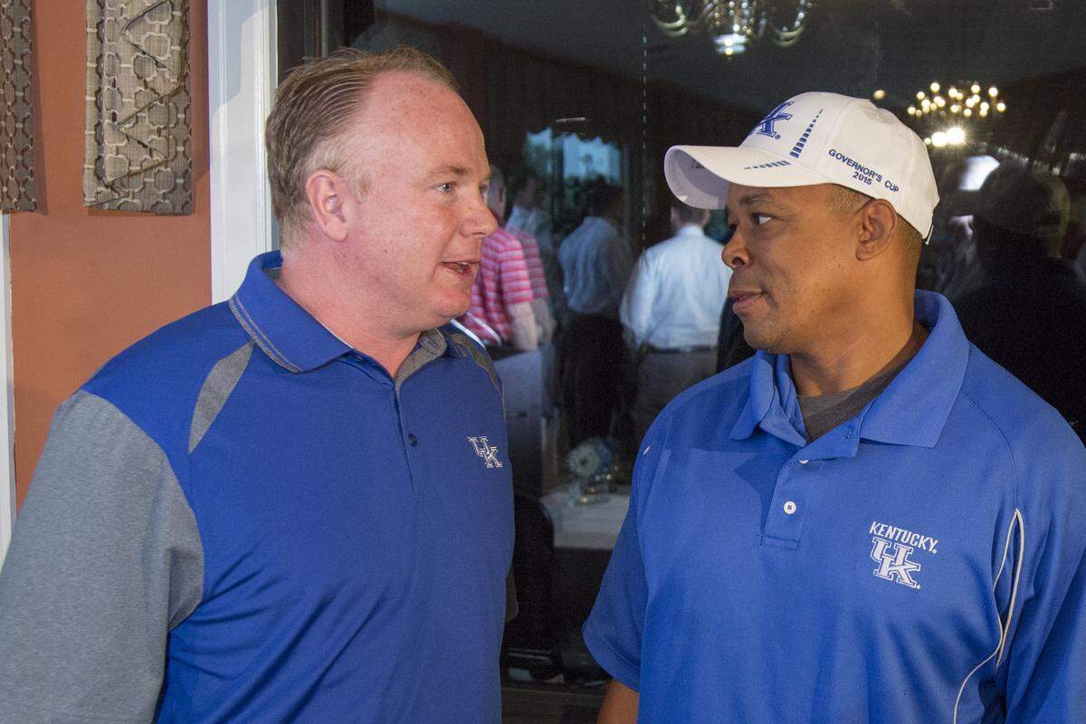 Mark Higgs, right, talked with Kentucky Coach Mark Stoops at the 2015 Governor’s Cup Luncheon.