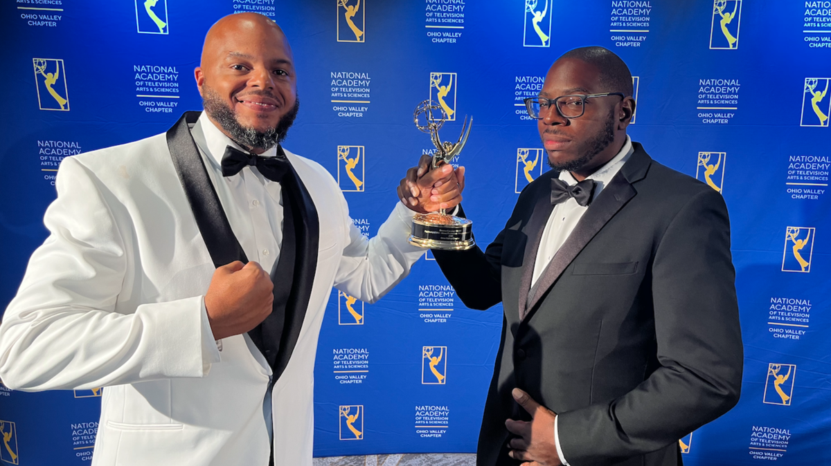 Devine Carama, left, and J.K. Wyche, right, hold their Emmy at the 2022 Ohio Valley Regional Emmy Awards on Saturday, July 30, 2022.