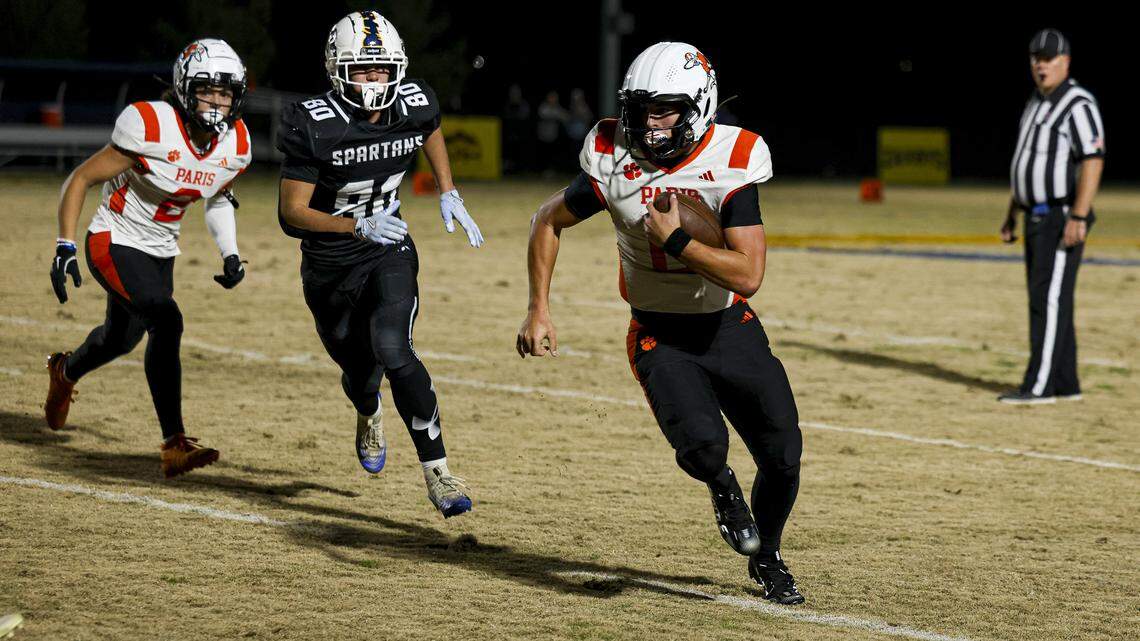 Paris quarterback Guy Turner looks upfield during the Greyhounds’ 14-10 win over Sayre in the second round of the Class A playoffs at the Sayre Athletic Complex on Friday.