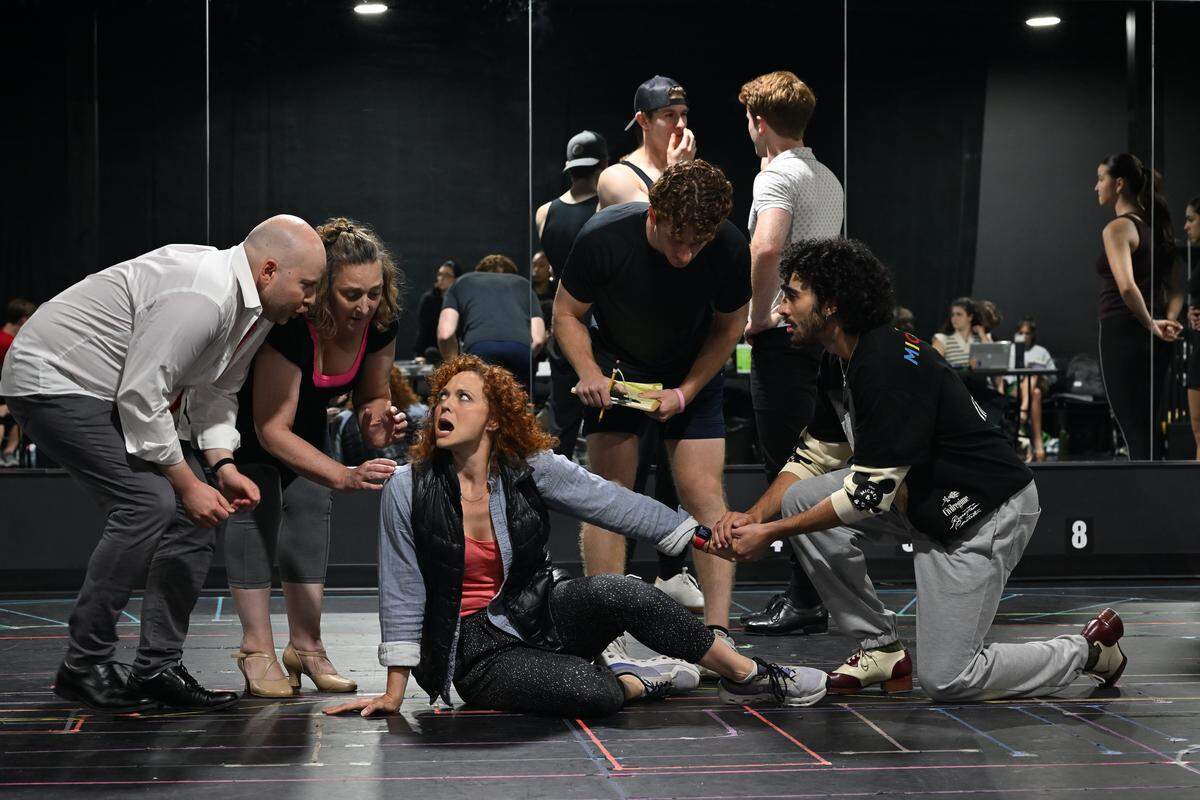 Brance Cornelius, Karyn Czar, Dan Klimko, and Ari'el Chaim Barmor rehearse a scene where they come to the aid of Kristen Beth Williams, playing Broadway diva Dorothy Brock, who has just fallen during a July 2, 2025 rehearsal for The Lexington Theatre Company’s production of “42nd Street.” The rehearsal was in the Theatre Company's Alex Theatre in its new headquarters on Alexandria Drive.