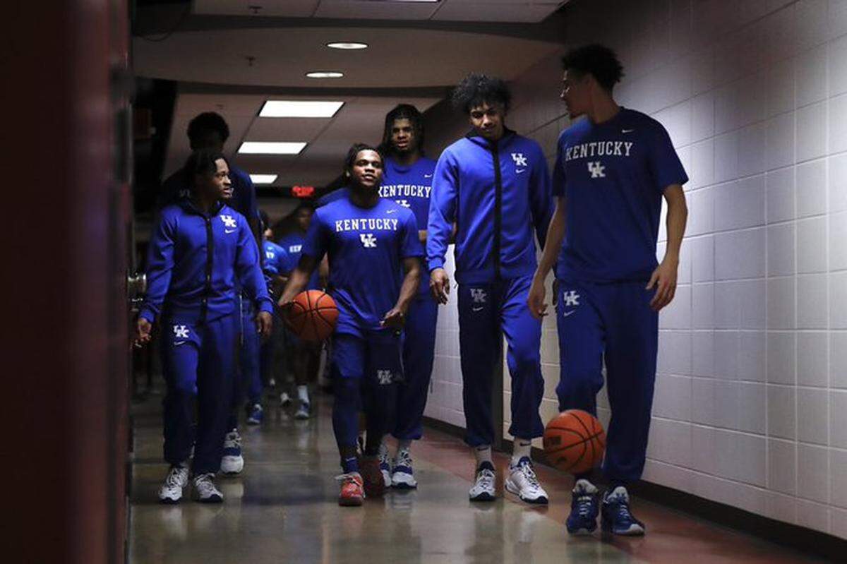 Kentucky’s players head to the court before Saturday night’s matchup with Alabama at Coleman Coliseum in Tuscaloosa, Ala.