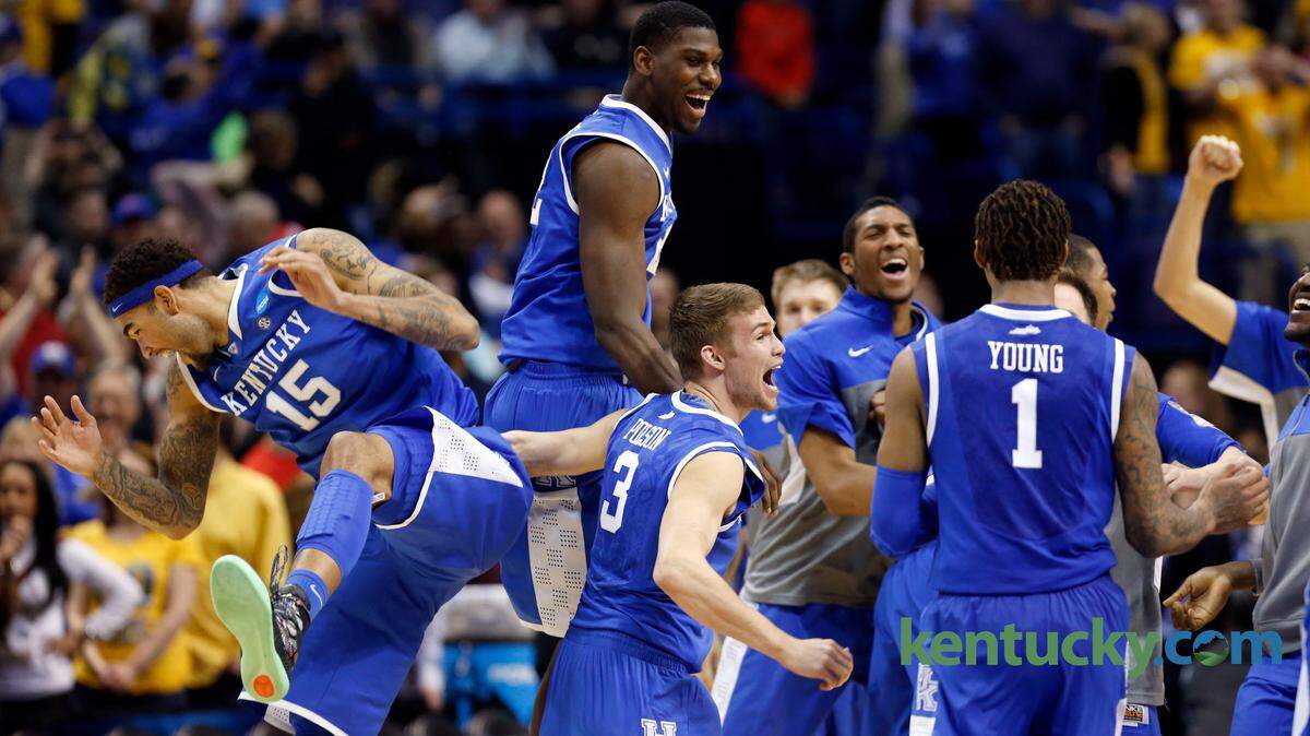 The University of Kentucky team celebrated after they defeated Wichita State in the Scottrade Center in St. Louis, Mo., Sunday, March 23, 2014. This is second half NCAA third round tournament action. UK won 78-76. Photo by Charles Bertram | Staff
