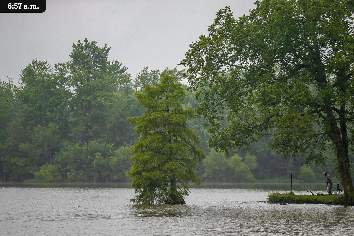 A fisherman waits for a bite at Jacobson Park reservoir in Lexington on Friday, July 9. The 216-acre park includes a basketball court, dog park, sprayground and marina. Paddle boats are also available for rent.