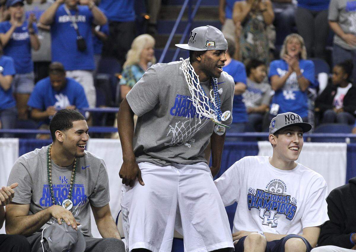 Darius Miller, center, won an NCAA title as part of the University of Kentucky men's basketball team in 2012. He's the only Kentuckian to win an NCAA title, a KHSAA title and Kentucky's Mr. Basketball award.