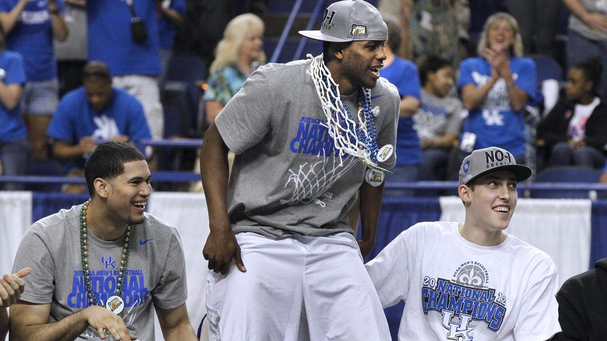 Darius Miller, center, won an NCAA title as part of the University of Kentucky men's basketball team in 2012. He's the only Kentuckian to win an NCAA title, a KHSAA title and Kentucky's Mr. Basketball award.