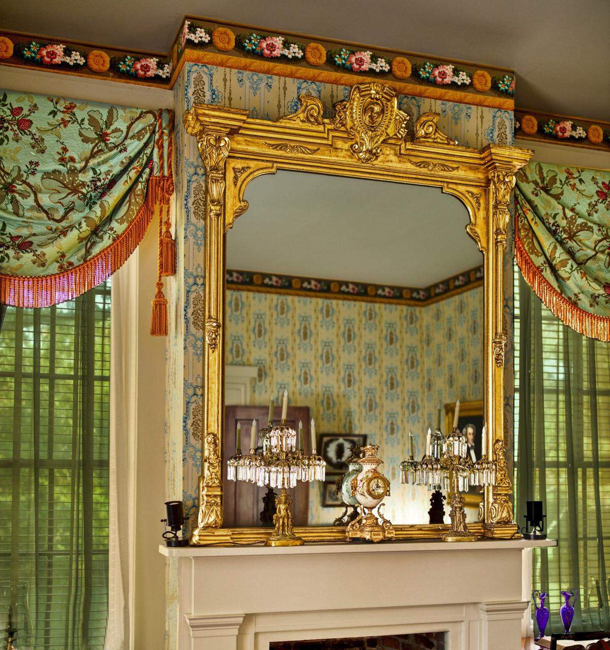 A family letter revealed that the gold-leaf wooden frame pier mirror was purchased in 1890 to hang in the east parlor. Pier mirrors were used to add more light to a room by reflecting sunlight.