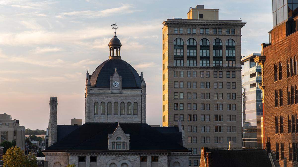 The rising sun shines on the downtown Lexington, Ky., skyline Friday, July 24, 2020.