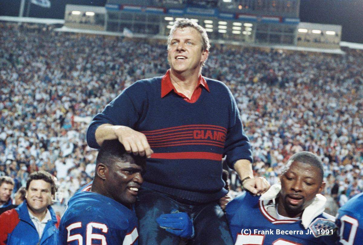 New York’s Lawrence Taylor and Carl Banks carry head coach Bill Parcells off the field after the Giants defeated the Buffalo Bills 20-19 in Super Bowl XXV in Tampa in 1991.
