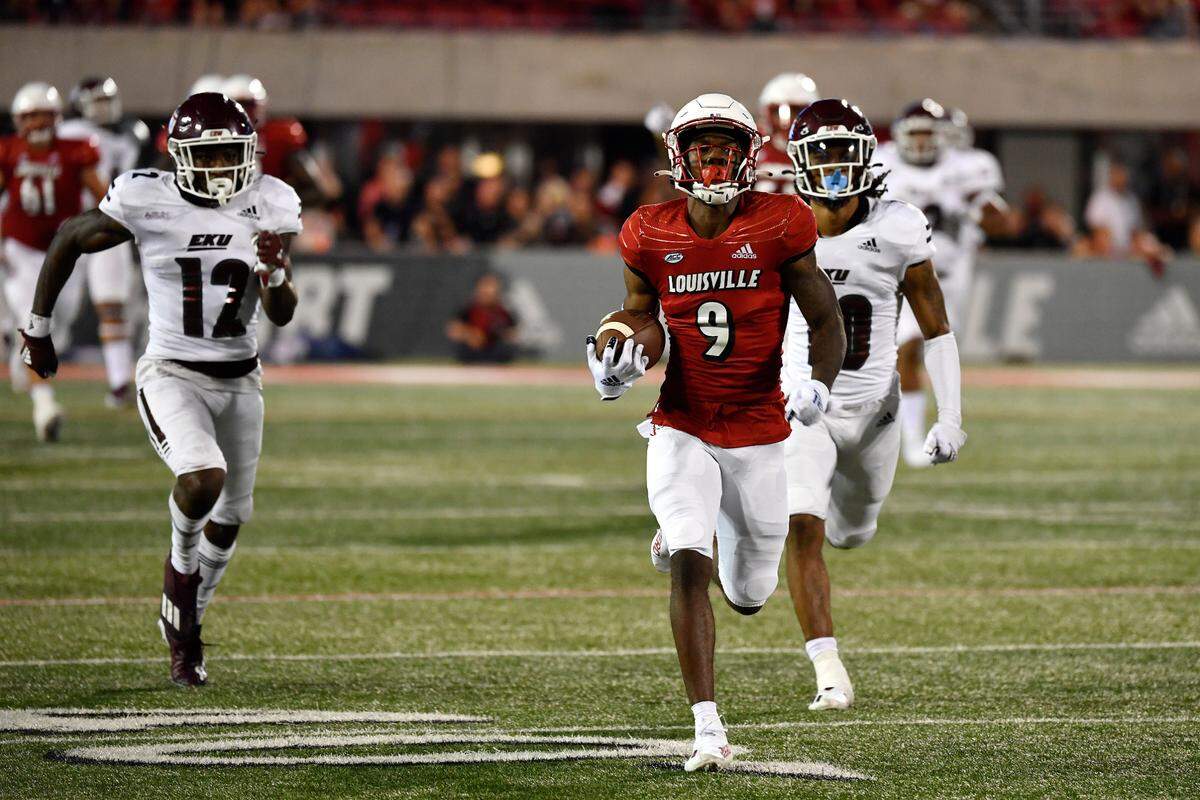 Louisville wide receiver Ahmari Huggins-Bruce (9) runs from the pursuit of Eastern Kentucky defensive back Josh Hayes (12) and cornerback Nic Cheeley (10). Huggins-Bruce finished with four receptions for 150 yards but made an embarrassing mistake late in the game.