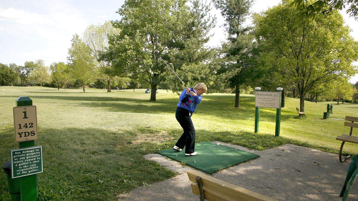 Sherrilyn Medley prepared to drive from the first tee Tuesday at Meadowbrook Golf Course. She said she started playing at the city-owned course more than 30 years ago.