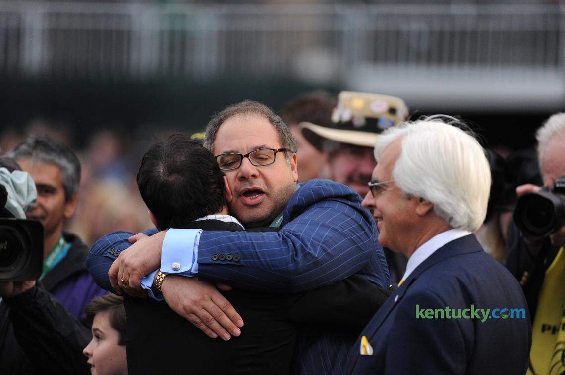 American Pharoah owner Ahmed Zayat celebrates victory in the 2015 Breeders’ Cup Classic at Keeneland as trainer Bob Baffert looks on.