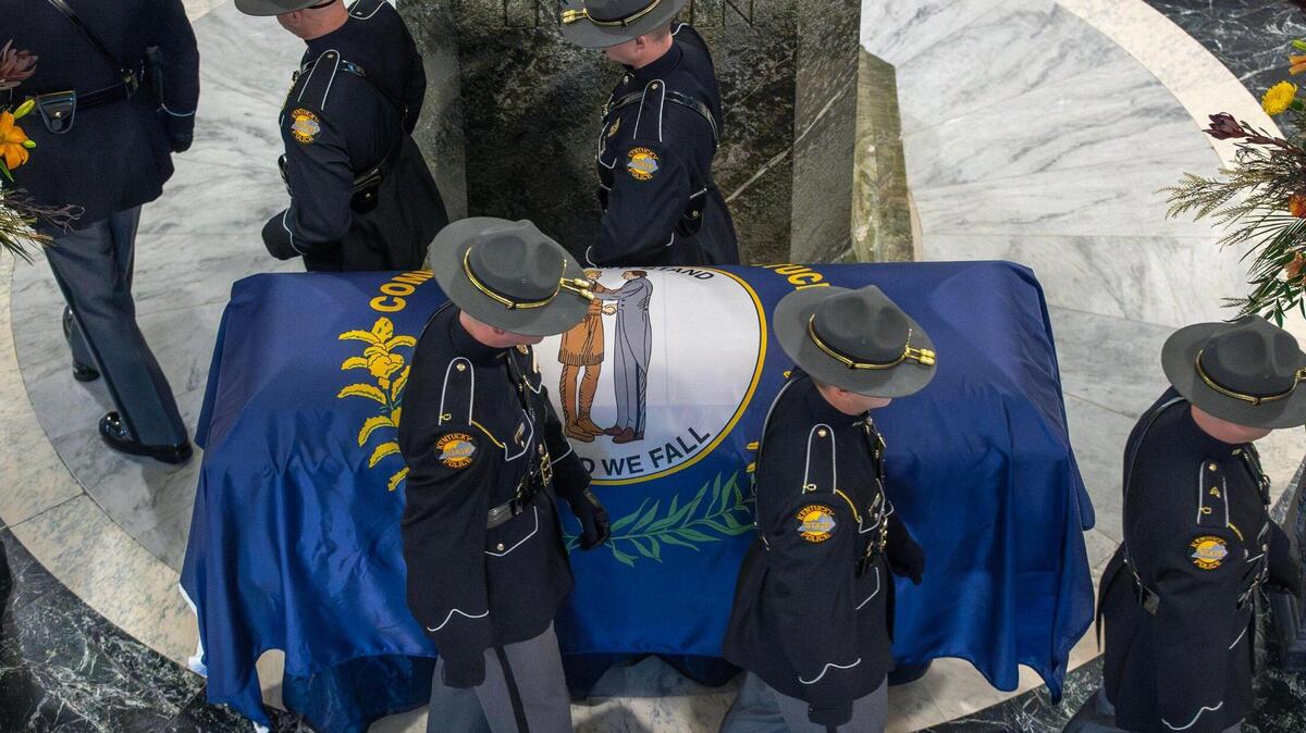 Members of the Kentucky State Police Honor Guard walk past the casket of former Kentucky Gov. Brereton Jones in the rotunda at the Kentucky state Capitol in Frankfort, Ky., on Monday, Sept. 25, 2023.
