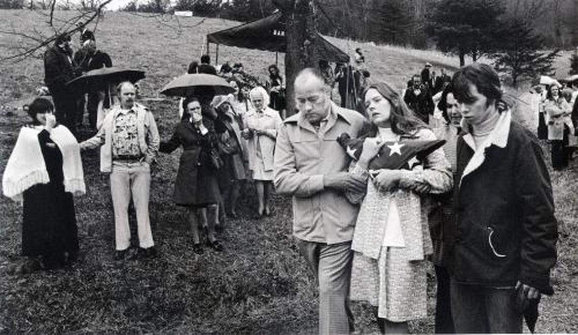 A widow grieved at the funeral of her husband, one of 26 miners and rescue workers killed in two explosions at the Scotia Mine in March 1976 in Letcher County. The tragedy reinforced need for the 1977 Mine Safety and Health Act.